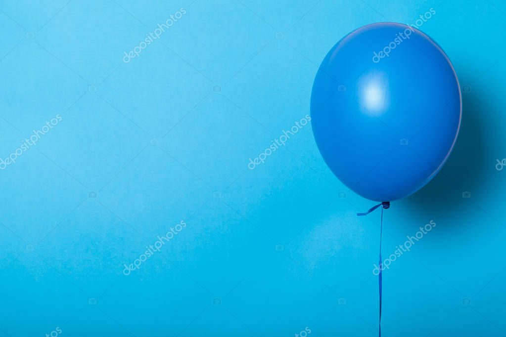Bright air balloon, helium. Minimal festive background. Empty space for text, logo.