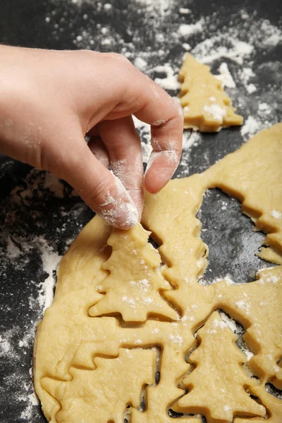 Cookie cutters, christmas tree bakery in flour. Stock Image