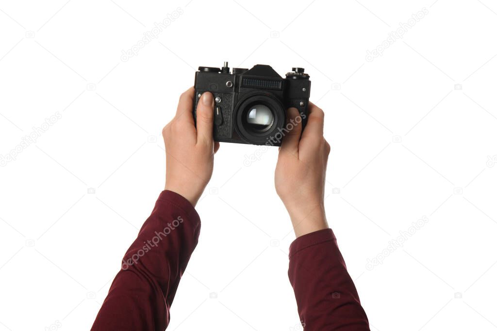 Vintage camera in hand isolated on white background. Photography and memories.
