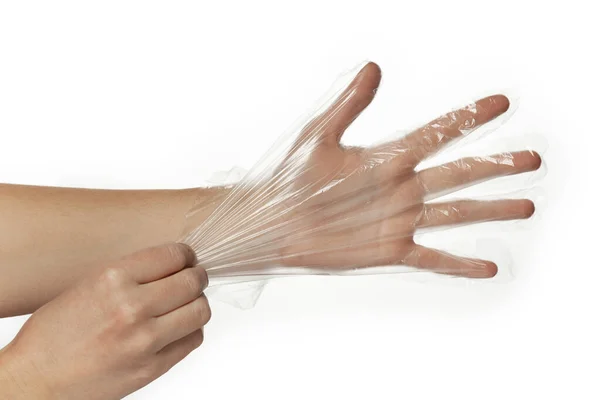 Tek kullanımlık şeffaf plastik eldivenler mağazadan alışveriş için ya da hazır yemek için, beyaz arka planda izole edilmiş..