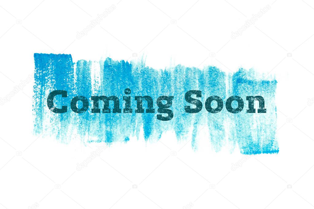 Coming soon on blue paint background, isolated on white. Advertising banner concept.