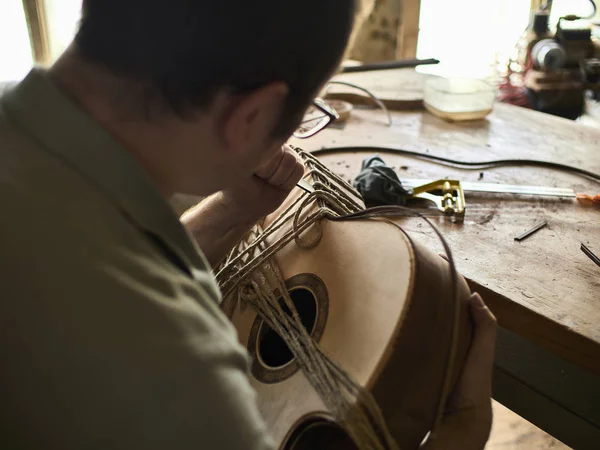 Luthier Install Binding on a guitar. — Stock Photo, Image