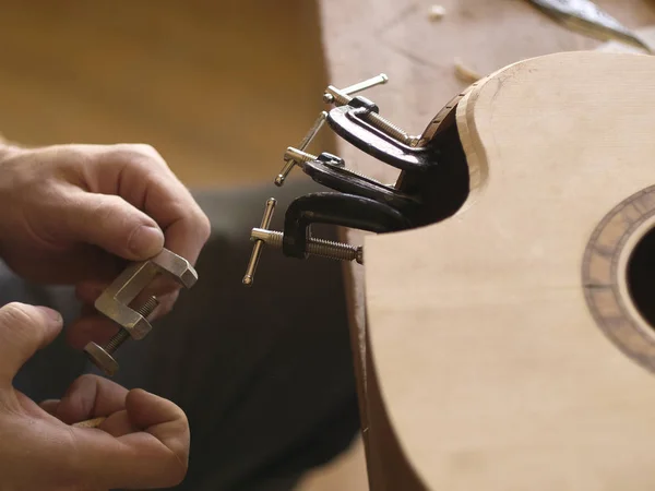 The process of making a cutaway on classical guitar. — Stock Photo, Image
