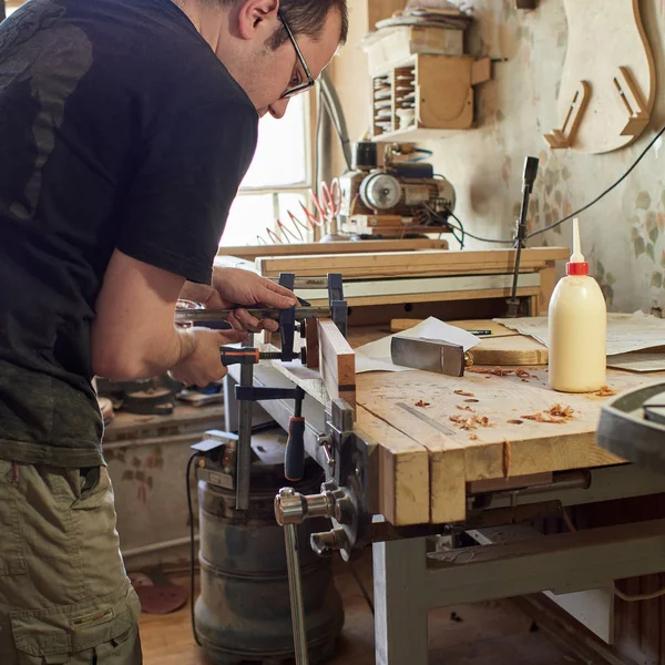 Marking and Pasting of footer and brace to the soundboard of classical guitar. — Stock Photo, Image