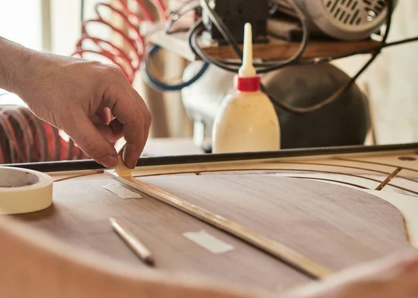 Marking and Pasting of footer and brace to the soundboard of classical guitar. — Stock Photo, Image