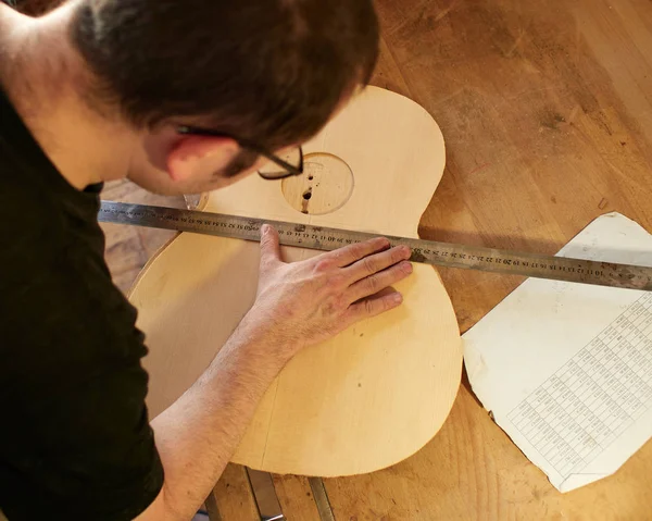 Marking and Pasting of footer and brace to the soundboard of classical guitar. — Stock Photo, Image