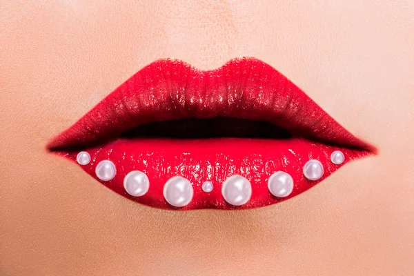 Beautiful red female lips with pearls — Stock Photo, Image