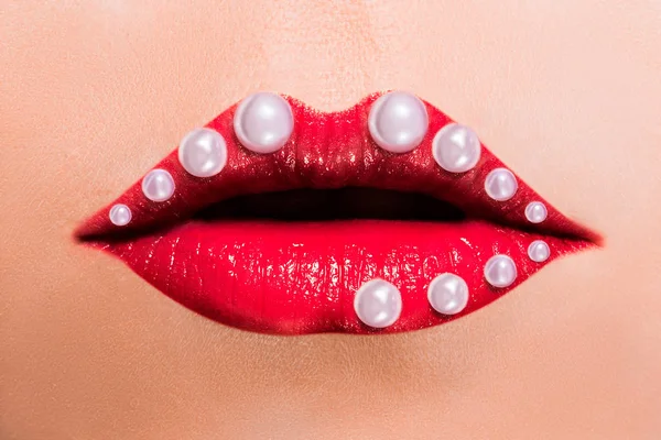 Beautiful red female lips with pearls — Stock Photo, Image