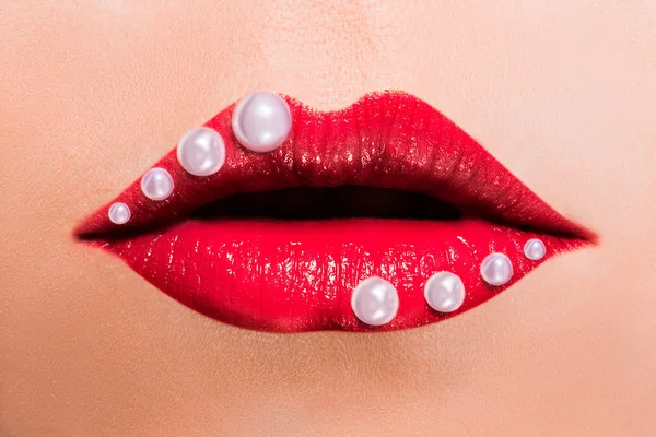 Beautiful red female lips with pearls — Stock Photo, Image