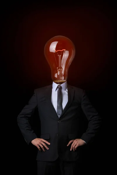 En man med en glödlampa huvud. — Stockfoto