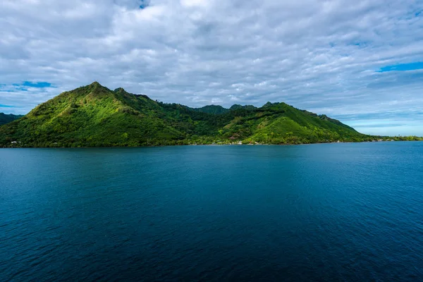 Wide angle photo of the island of Morrea, part of French Polynesia, in the morning.