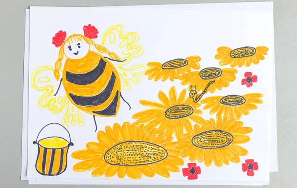Kid drawing of bee flying over flowers collecting pollen and making honey isolated on white background - child colorful scribble doodle of beekeeping theme.