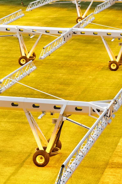 Artificial light system for growing lawns on football stadiums