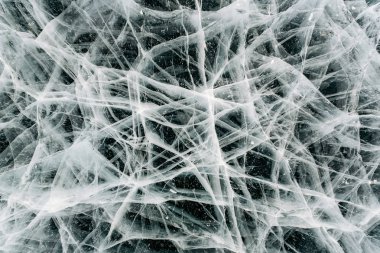 Doku bir örümcek ağı gibi donmuş çatlaklar, donmuş buz. Baykal, Rusya Federasyonu