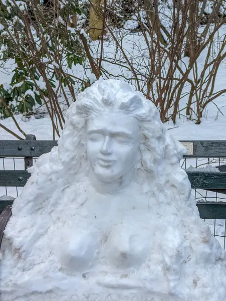 Snow sculpture on a bench in Central Park New York