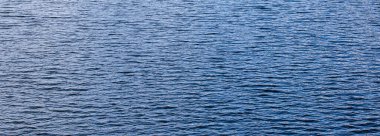 Mavi deniz suyu yüzey arkaplanının dokusu