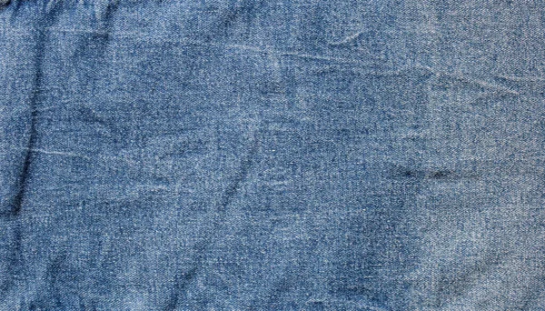 蓝色牛仔斜纹棉布的质地背景 — 图库照片
