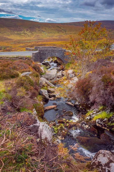 Old stone bridge crossing a river in Wicklow Mountains, Ireland - many movie scenes were shot here