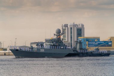 Small anti-submarine ship runs along Kronstadt during the celebration of the Day of The Navy. 28 July 2019. clipart