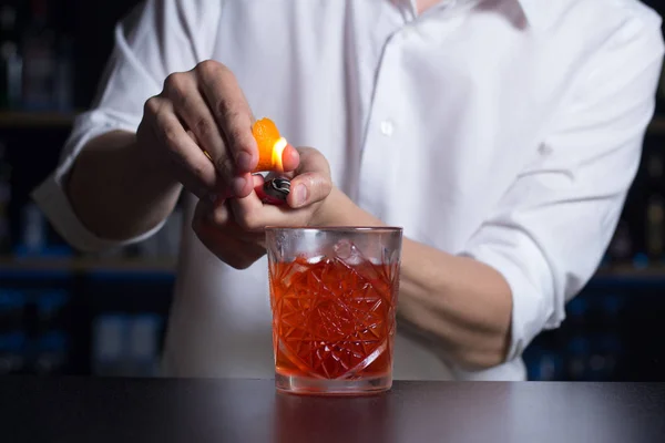 Bartender White Shirt Makes Flame Cocktail Orange Peel Close — Stock Photo, Image