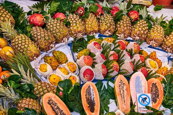 The abundance of exotic exotic fruits - mango, papaya, pineapple, dragon fruit, Pitahaya, rollinia deliciosa, biriba. Expensive market, shop, bazaar, supermarket with products for a vegetarian.