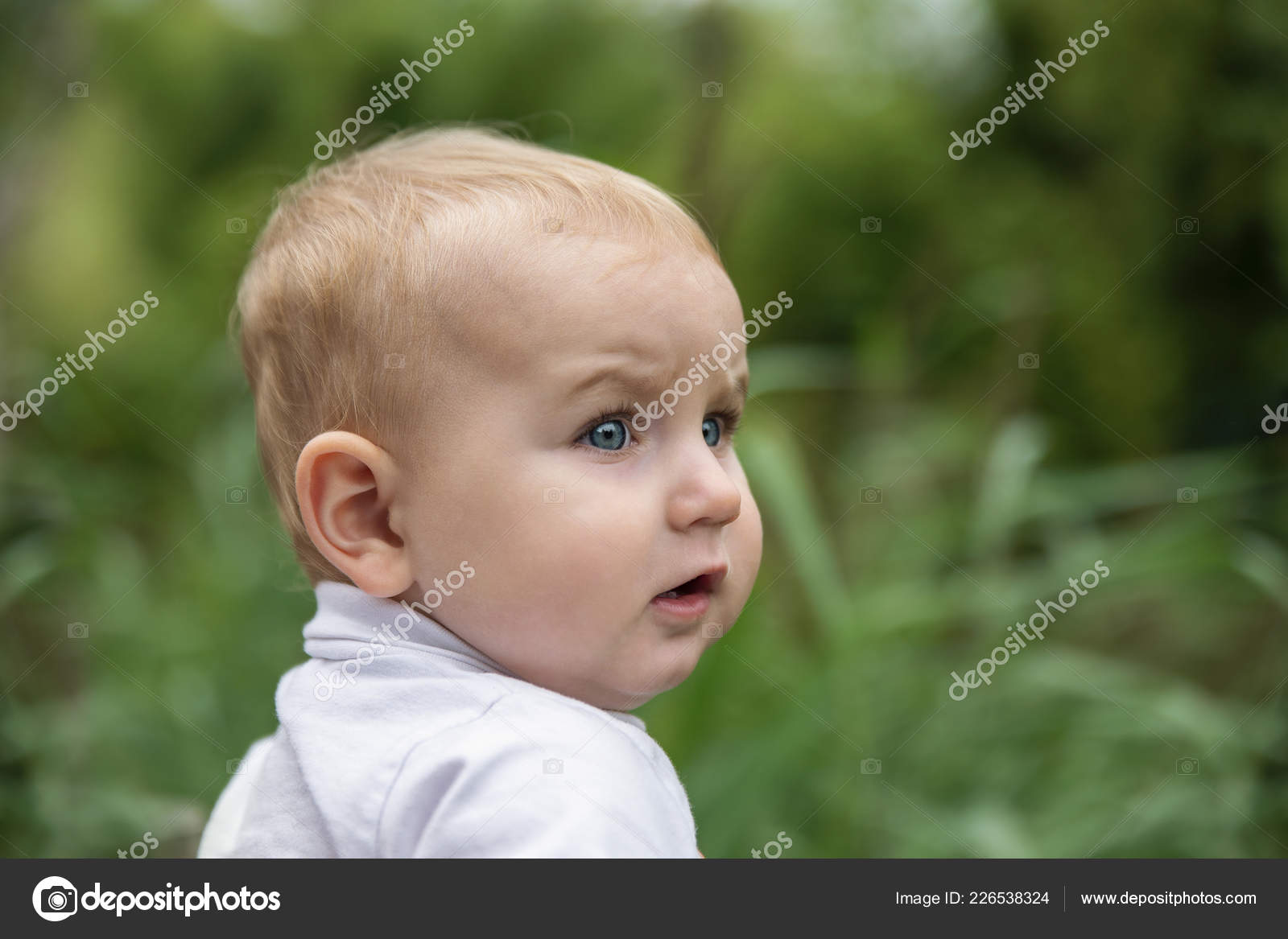 Little Blue Eyed Child Blond Hair Looks Very Attentively Intently