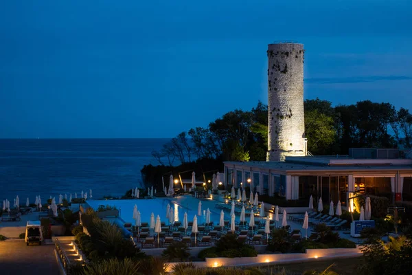 Ancient traditional stone lighthouse in dawn