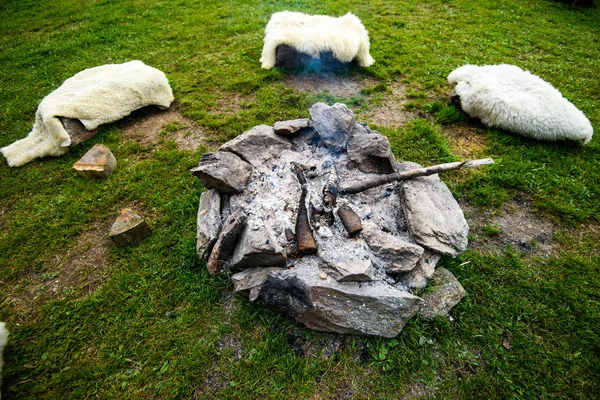 Camp fire made of stone ring, traditional, authentic, laid out in a circle