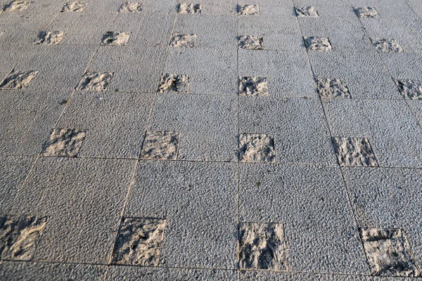 Pavimento de pedra abstrato, lado iluminado textura no chão — Fotografia de Stock