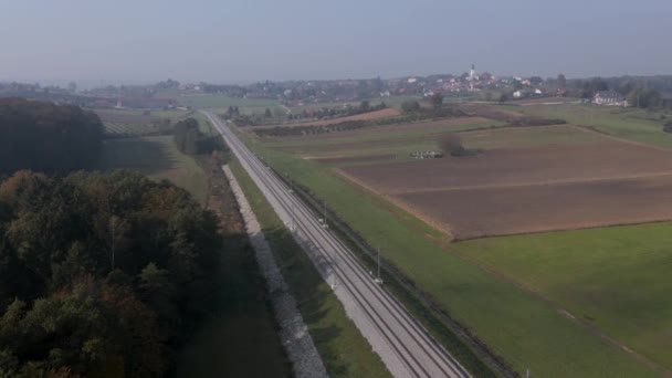 Aerial shot of railroad tracks in rural countryside — Stock Video