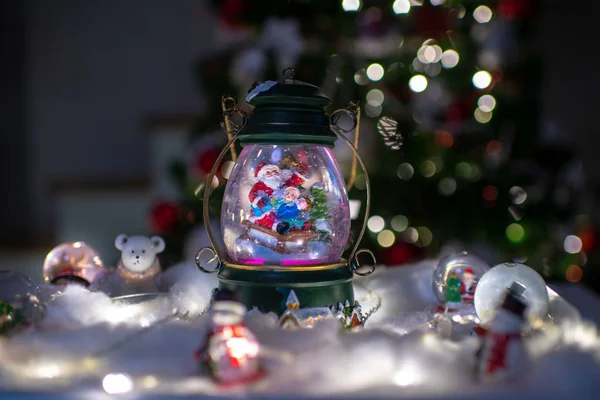 Christmas decoration, snow dome, globe with table decoration — Stock Photo, Image