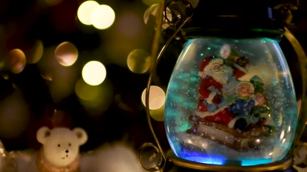 Christmas scene, Santa with child on a sleigh in snow dome — Stock Video