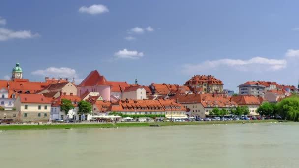 Lent is the popular waterfront of Maribor, Slovenia, river with mediaeval town in background — Stock Video