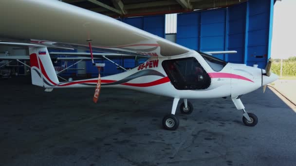 Light sport airplane in hangar, Pipistrel Virus 912, private propeller aircraft — Stock Video