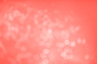 Yaşayan mercan renginde soyut bulanık parıltılı arka plan 