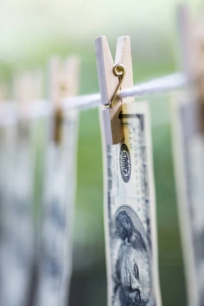 Money Laundering. Money Laundering US dollars hung out to dry. 100 dollar bills hanging on clotheslines