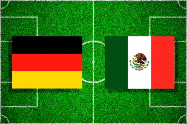 Flag Germany - Mexico on the football field. Football match