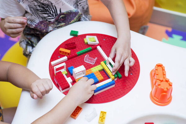 The child collects the Designer. Kids activity in kindergarten or at home