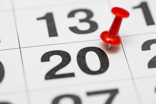 Pin on the date number 20. The twentieth day of the month is marked with a red thumbtack. Pin on calendar