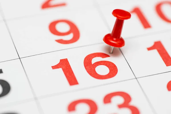 Pin on the date number 12. The twelfth day of the month is marked with a red thumbtack. Pin on calendar