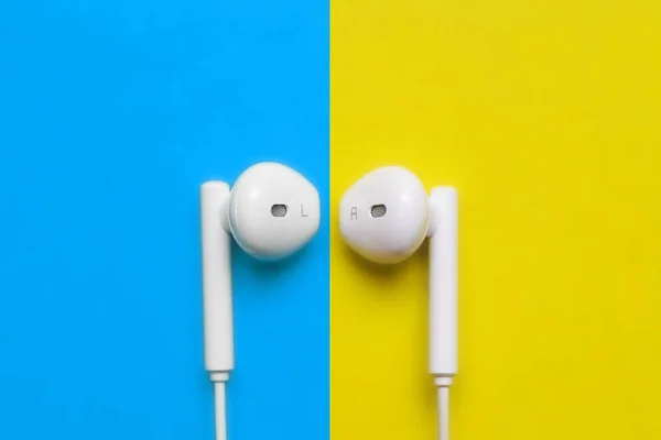 Earbuds Earphones Colorful Background White Headphones Yellow Blue Background Top — Stock Photo, Image