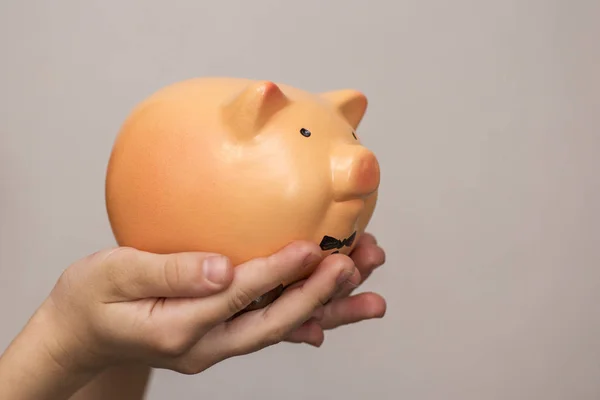 Kid hold a pig bank, a saving money for future education concept. Little girl holding a piggy bank — Stock Photo, Image