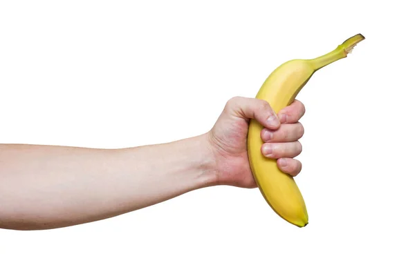 Ung mans hand håller en vacker, fräsch, gul banan. Manliga handen håller en banan på vit bakgrund — Stockfoto