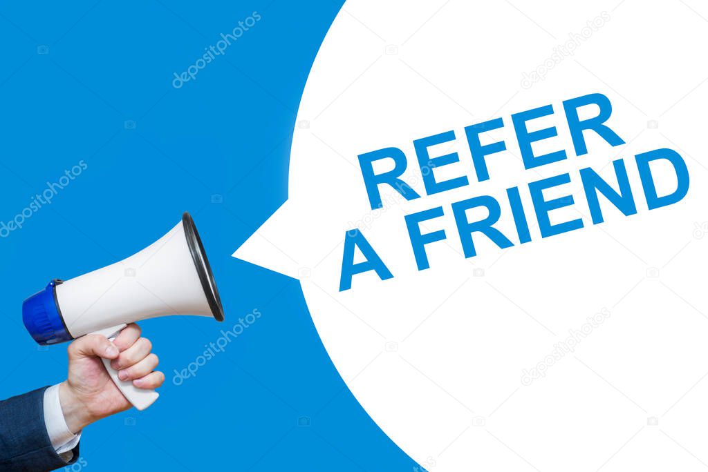 Man's Hand Holding Megaphone With Speech Bubble REFER A FRIEND. Banner For Business, Announcement, Marketing And Advertising.