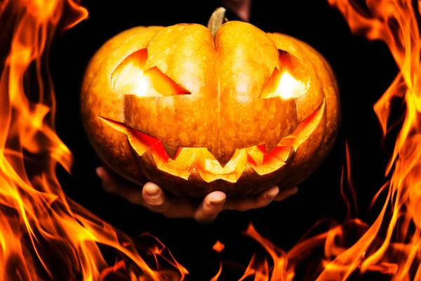 Fire Halloween Pumpkin Burning Eyes Mouth Mans Hand Hand Shows — Stock Photo, Image