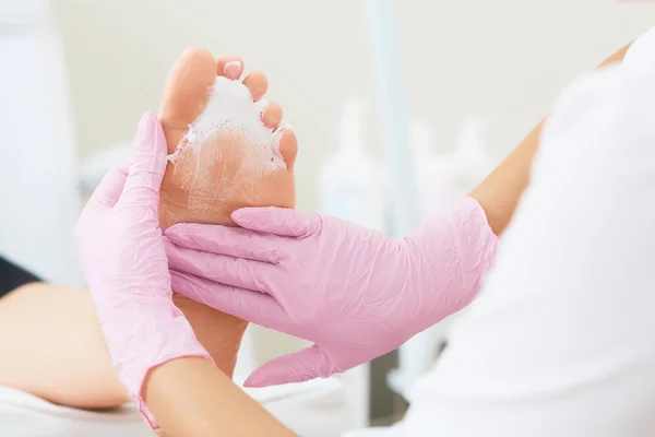 Professional pedicure using dieffenbach scalpel. Medical pedicure procedure  using special instrument. Treatment of calluses and skin fungus. Beauty &  Fashion Stock Photos