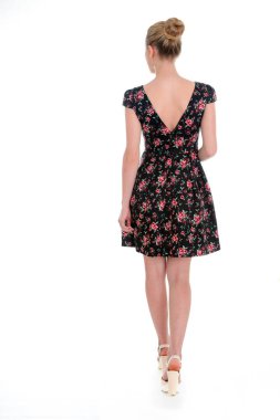 Woman in short floral dress. Wedge sandals and summer dress. Casual look for warm season. Garment made of flax. clipart
