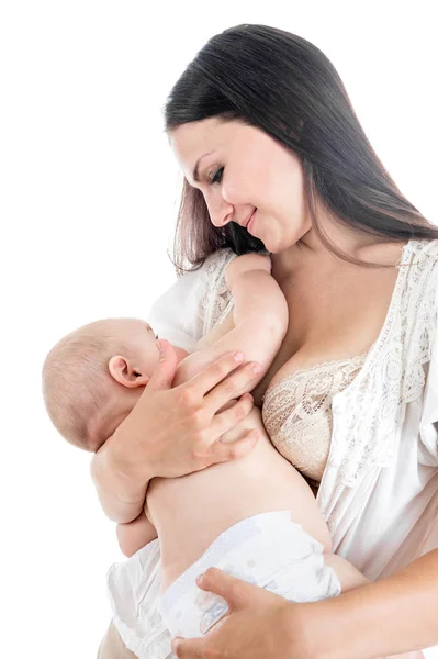 Mother breast feeding her infant studio shot — Stock Photo, Image