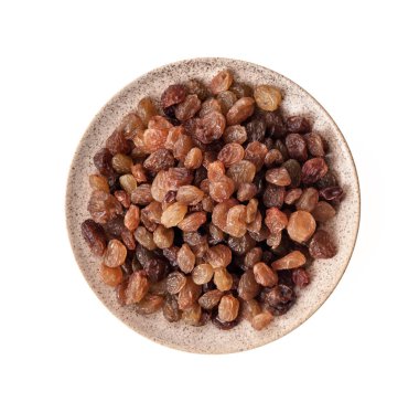 Uçan daire beyaz arka plan üzerinde izole içinde Kuru üzüm. Üstten Görünüm