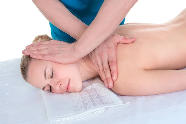 Shoulder and neck massage for woman in spa salon. Doctor making